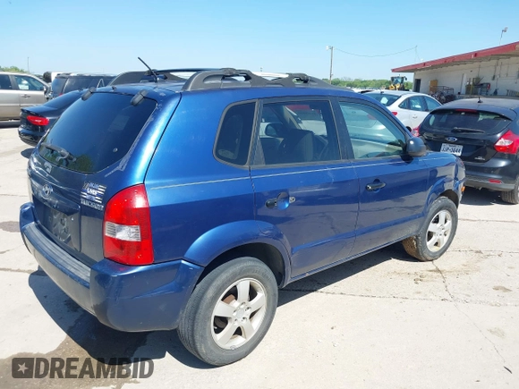 2006 Hyundai Tucson GL with VIN KM8JM12B06U386154, listed as a IAAI auction lot 41989899 with 168,069 mi miles. Bid and sale history available at carsss.com. Image 4.