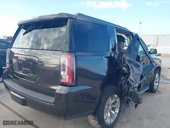 2016 GMC Yukon SLT with VIN 1GKS2BKC1GR406739, listed as a IAAI auction lot 41247286 with 106,023 mi miles. Bid and sale history available at carsss.com. Image 4.