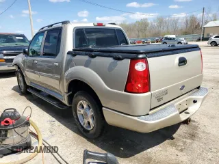 2005 Ford Explorer Sport Trac XLS with VIN 1FMDU77K35UA00852, listed as a Copart auction lot 52209715 with 247,583 mi miles and Salvage title. Bid and sale history available at DreamBid. Image 2.