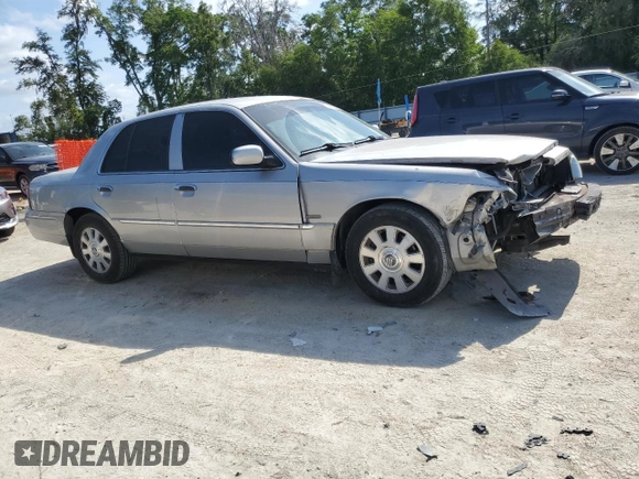 2003 Mercury Grand Marquis LS Premium with VIN 2MEHM75W63X697725, listed as a Copart auction lot 54485505 with 129,194 mi miles and Salvage Title. Bid and sale history available at DreamBid. Image 4.