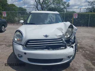 2014 MINI Countryman z VIN WMWZB3C50EWR37412, wystawiony jako IAAI lot #42330526 z przebiegiem 139 310 mil mil oraz . Historia ofert i sprzedaży dostępna na DreamBid. Obrazek 13.