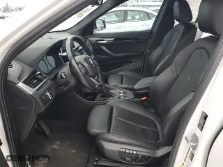 2019 BMW X1 xDrive28i with VIN WBXHT3C54K5L91407, listed as a Copart auction lot 84875904 with 97,304 mi miles and Salvage Title. Bid and sale history available at carsss.com. Image 7.