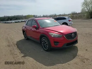 2016 Mazda CX-5 Grand Touring z VIN JM3KE2DY2G0705650, wystawiony jako Copart lot #53808365 z przebiegiem 123 611 mil mil oraz Szkoda całkowita • Salvage title. Historia ofert i sprzedaży dostępna na DreamBid. Obrazek 11.