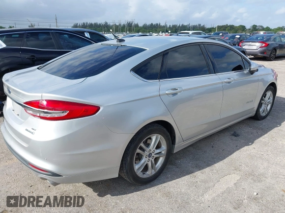 2018 Ford Fusion SE z VIN 3FA6P0LU2JR281231, wystawiony jako IAAI lot #41963083 z przebiegiem 115 434 mil mil oraz . Historia ofert i sprzedaży dostępna na DreamBid. Obrazek 4.