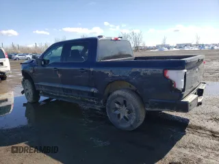 2023 Ford F-150 Lightning Pro with VIN 1FT6W1EV4PWG24488, listed as a Copart auction lot 51523945 with Not provided miles and Salvage title. Bid and sale history available at DreamBid. Image 2.