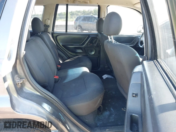 2002 Jeep Grand Cherokee z VIN 1J4GX38S32C238339, wystawiony jako IAAI lot #42653341 z przebiegiem 264 189 mil mil oraz . Historia ofert i sprzedaży dostępna na DreamBid. Obrazek 8.