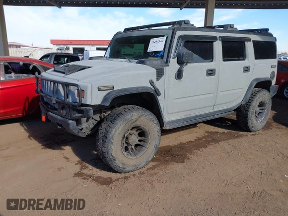 2003 Hummer H2 with VIN 5GRGN23U13H128617, listed as a IAAI auction lot 41494349 with 135,295 mi miles. Bid and sale history available at carsss.com. Image 2.