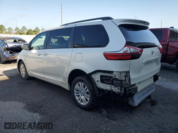 2015 Toyota Sienna XLE with VIN 5TDYK3DC0FS679812, listed as a Copart auction lot 61600775 with 118,483 mi miles and Salvage title. Bid and sale history available at DreamBid. Image 2.