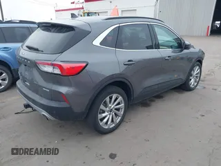 2021 Ford Escape Titanium with VIN 1FMCU9J92MUA27097, listed as a IAAI auction lot 41542774 with 14,822 mi miles and . Bid and sale history available at carsss.com. Image 4.