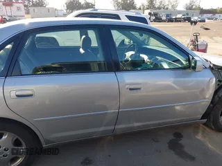 2003 Toyota Avalon XL z VIN 4T1BF28B03U321618, wystawiony jako IAAI lot #42297842 z przebiegiem 142 154 mil mil oraz . Historia ofert i sprzedaży dostępna na DreamBid. Obrazek 14.