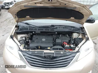 2014 Toyota Sienna XLE with VIN 5TDYK3DC1ES416999, listed as a IAAI auction lot 41972378 with 119,179 mi miles. Bid and sale history available at carsss.com. Image 10.