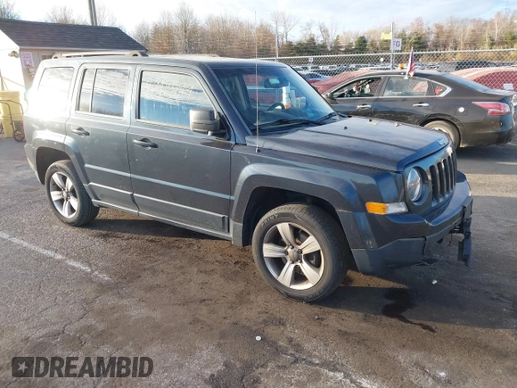 2014 Jeep Patriot Latitude with VIN 1C4NJRFB4ED720241, listed as a IAAI auction lot 40914199 with 128,218 mi miles. Bid and sale history available at carsss.com. Image 1.