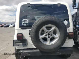 2000 Jeep Wrangler Sahara with VIN 1J4FA59S6YP790541, listed as a Copart auction lot 53837885 with 137,827 mi miles and Salvage title. Bid and sale history available at DreamBid. Image 6.