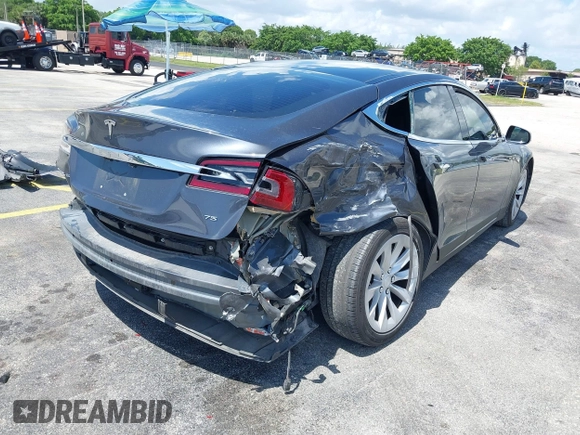 2016 Tesla Model S 70 with VIN 5YJSA1E16GF156312, listed as a IAAI auction lot 42469451 with 90,317 mi miles and . Bid and sale history available at DreamBid. Image 6.