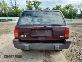 1994 Jeep Grand Cherokee Laredo z VIN 1J4GZ58S0RC221854, wystawiony jako Copart lot #61950825 z przebiegiem 69 465 mil mil oraz Czysty tytuł • Clean title. Historia ofert i sprzedaży dostępna na DreamBid. Obrazek 6.