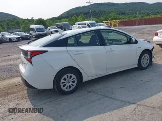 2021 Toyota Prius L Eco with VIN JTDKAMFU7M3147668, listed as a IAAI auction lot 42390394 with 80,831 mi miles and . Bid and sale history available at DreamBid. Image 4.