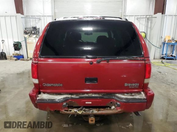 1999 Oldsmobile Bravada z VIN 1GHDT13W4X2705200, wystawiony jako Copart lot #43416245 z przebiegiem 173 522 mil mil oraz Szkoda całkowita • Salvage title. Historia ofert i sprzedaży dostępna na DreamBid. Obrazek 6.