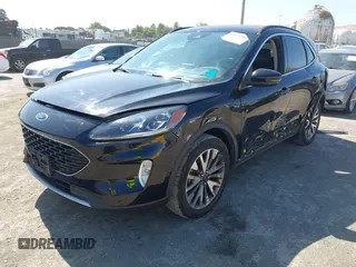2020 Ford Escape Titanium z VIN 1FMCU9J97LUB18350, wystawiony jako IAAI lot #42574736 z przebiegiem 82 551 mil mil oraz . Historia ofert i sprzedaży dostępna na DreamBid. Obrazek 19.