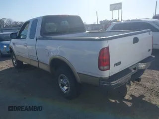 1999 Ford F-150 XL with VIN 1FTRX18L3XKB33860, listed as a IAAI auction lot 41664761 with 305,767 mi miles. Bid and sale history available at carsss.com. Image 3.
