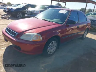 1997 Honda Civic LX with VIN 1HGEJ6678VL030963, listed as a IAAI auction lot 41880866 with 142,472 mi miles. Bid and sale history available at carsss.com. Image 2.
