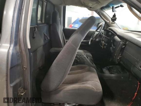 2003 Dodge Dakota z VIN 1D7GG16X23S204317, wystawiony jako Copart lot #54830745 z przebiegiem 139 508 mil mil oraz Szkoda całkowita • Salvage title. Historia ofert i sprzedaży dostępna na DreamBid. Obrazek 10.