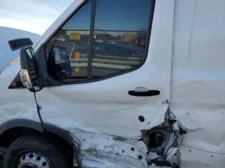 2016 Ford Transit Cargo with VIN 1FTBF4XG7GKA26157, listed as a Copart auction lot 84770754 with 137,282 mi miles and Salvage Title. Bid and sale history available at carsss.com. Image 7.