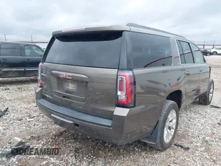 2015 GMC Yukon XL SLT with VIN 1GKS2HKC6FR582574, listed as a IAAI auction lot 41187550 with 185,737 mi miles. Bid and sale history available at carsss.com. Image 4.