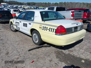1999 Ford Crown Victoria Police with VIN 2FAFP71WXXX239705, listed as a IAAI auction lot 41601390 with 161,454 mi miles. Bid and sale history available at carsss.com. Image 3.
