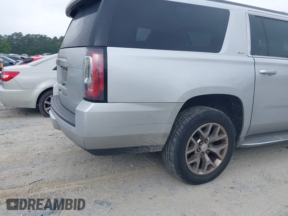 2015 GMC Yukon XL SLT with VIN 1GKS1HKC2FR251672, listed as a IAAI auction lot 42152312 with 232,736 mi miles and . Bid and sale history available at carsss.com. Image 6.