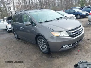2014 Honda Odyssey Touring with VIN 5FNRL5H94EB020257, listed as a IAAI auction lot 41924245 with 204,526 mi miles and . Bid and sale history available at carsss.com. Image 1.