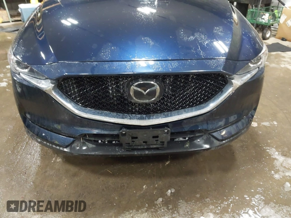2020 Mazda CX-5 Touring z VIN JM3KFBCM9L0843045, wystawiony jako IAAI lot #41361008 z przebiegiem 76 107 mil mil oraz . Historia ofert i sprzedaży dostępna na DreamBid. Obrazek 12.