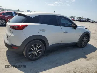 2017 Mazda CX-3 Touring z VIN JM1DKDC75H0168823, wystawiony jako Copart lot #57968955 z przebiegiem 116 231 mil mil oraz Szkoda całkowita • Salvage title. Historia ofert i sprzedaży dostępna na DreamBid. Obrazek 3.