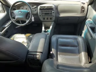 2002 Ford Explorer Sport Trac Value with VIN 1FMZU67E42UD15004, listed as a Copart auction lot 54129135 with 129,952 mi miles and Salvage title. Bid and sale history available at DreamBid. Image 8.