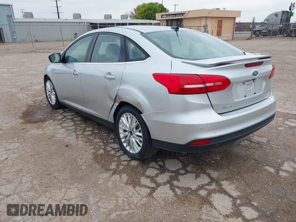 2017 Ford Focus Titanium with VIN 1FADP3J24HL229702, listed as a IAAI auction lot 42057013 with 120,250 mi miles and . Bid and sale history available at DreamBid. Image 3.