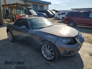 2006 Mazda MX-5 Miata Sport z VIN JM1NC25F260115830, wystawiony jako Copart lot #76844774 z przebiegiem 52 599 mil mil oraz Szkoda całkowita • Salvage title. Historia ofert i sprzedaży dostępna na DreamBid. Obrazek 4.