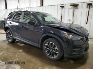 2016 Mazda CX-5 Grand Touring with VIN JM3KE4DY2G0738899, listed as a Copart auction lot 50943255 with 80,807 mi miles and Salvage Title. Bid and sale history available at carsss.com. Image 4.