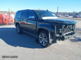 2015 Chevrolet Tahoe LTZ with VIN 1GNSCCKC8FR581994, listed as a IAAI auction lot 41406219 with 187,802 mi miles. Bid and sale history available at carsss.com. Image 1.