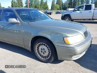 2001 Infiniti Q45 Touring z VIN JNKBY31A41M100704, wystawiony jako IAAI lot #42346520 z przebiegiem 73 073 mil mil oraz . Historia ofert i sprzedaży dostępna na DreamBid. Obrazek 6.