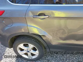 2014 Ford Escape SE z VIN 1FMCU0G99EUB25967, wystawiony jako IAAI lot #41805970 z przebiegiem 72 770 mil mil oraz . Historia ofert i sprzedaży dostępna na DreamBid. Obrazek 17.