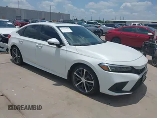 2023 Honda Civic Touring with VIN 2HGFE1F97PH319183, listed as a IAAI auction lot 42372563 with 45,583 mi miles and . Bid and sale history available at DreamBid. Image 1.