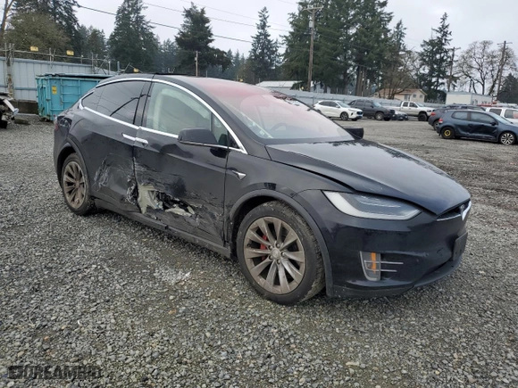 2017 Tesla Model X P100D with VIN 5YJXCDE49HF053723, listed as a Copart auction lot 87761395 with NaN miles and Salvage Title. Bid and sale history available at carsss.com. Image 4.