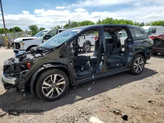 2023 Honda Odyssey Touring z VIN 5FNRL6H80PB035726, wystawiony jako Copart lot #57247805 z przebiegiem Nie podano mil oraz Szkoda całkowita • Salvage title. Historia ofert i sprzedaży dostępna na DreamBid. Obrazek 1.