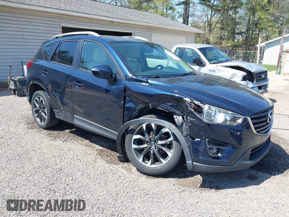 2016 Mazda CX-5 Grand Touring with VIN JM3KE4DY5G0681369, listed as a IAAI auction lot 42102805 with 128,182 mi miles and . Bid and sale history available at DreamBid. Image 1.