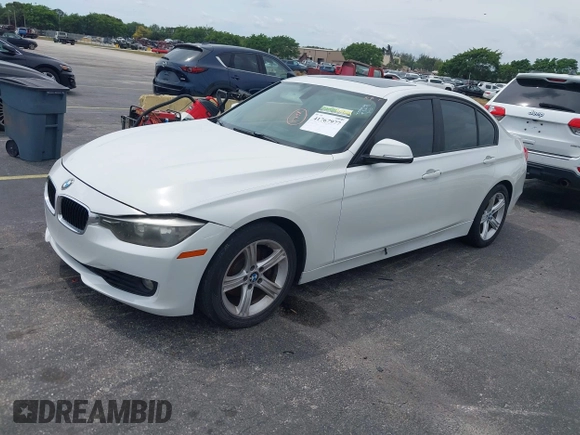2013 BMW 3 Series 328i with VIN WBA3A5G51DNP26142, listed as a IAAI auction lot 41767977 with 129,440 mi miles. Bid and sale history available at carsss.com. Image 2.