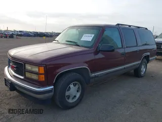 1999 GMC Suburban with VIN 1GKEC16R3XJ707787, listed as a IAAI auction lot 41826640 with 175,437 mi miles. Bid and sale history available at carsss.com. Image 2.