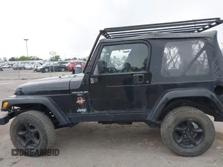 2000 Jeep Wrangler Sahara with VIN 1J4FA59S7YP805628, listed as a IAAI auction lot 42259201 with Not provided miles and . Bid and sale history available at DreamBid. Image 6.
