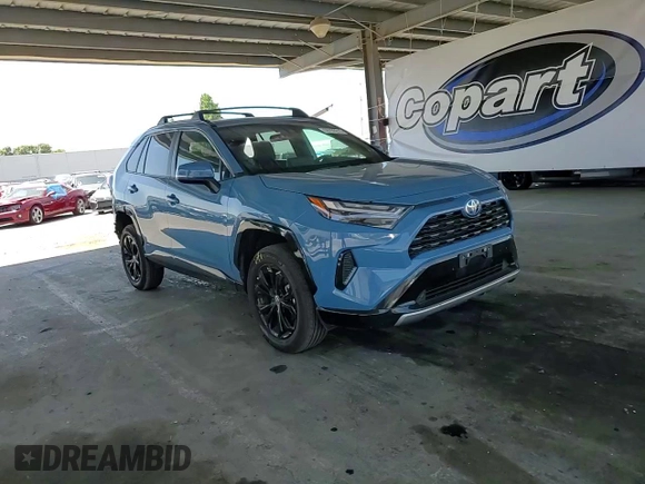 2022 Toyota RAV4 Hybrid SE with VIN 4T3T6RFV7NU103423, listed as a Copart auction lot 59709215 with 27,595 mi miles and Salvage title. Bid and sale history available at DreamBid. Image 14.