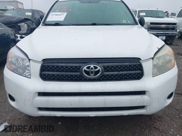 2006 Toyota RAV4 with VIN JTMBD33VX65015543, listed as a IAAI auction lot 41986857 with 124,709 mi miles. Bid and sale history available at carsss.com. Image 6.