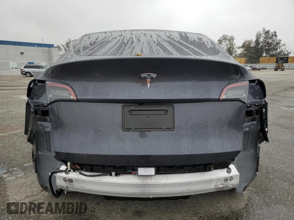 2024 Tesla Model Y with VIN 7SAYGDED5RF093410, listed as a Copart auction lot 50557225 with 6,396 mi miles and Salvage Title. Bid and sale history available at DreamBid. Image 6.
