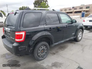 2008 Ford Escape Hybrid with VIN 1FMCU59H68TB26124, listed as a IAAI auction lot 42062917 with 197,929 mi miles. Bid and sale history available at carsss.com. Image 4.